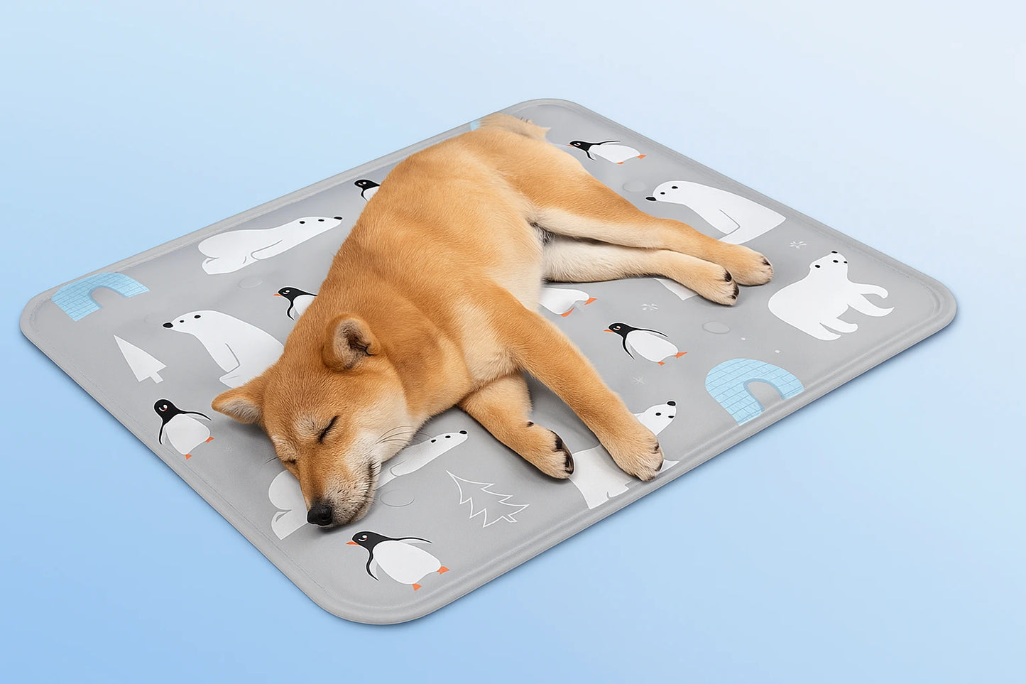 Dog peacefully sleeping on polar bear and penguin printed cooling mat on light blue background